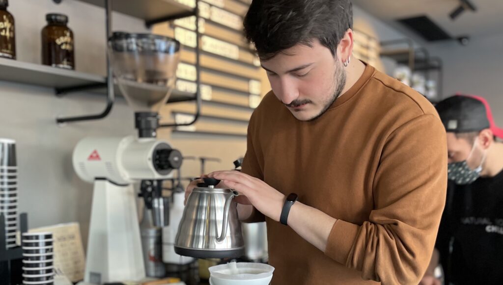 Barista Erdem Özmen is making pour-over coffee 